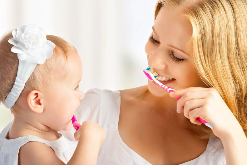 Depositphotos_33217585_XL Family brushing their teeth together at home, promoting healthy oral hygiene habits recommended by a Calgary Northwest dentist.